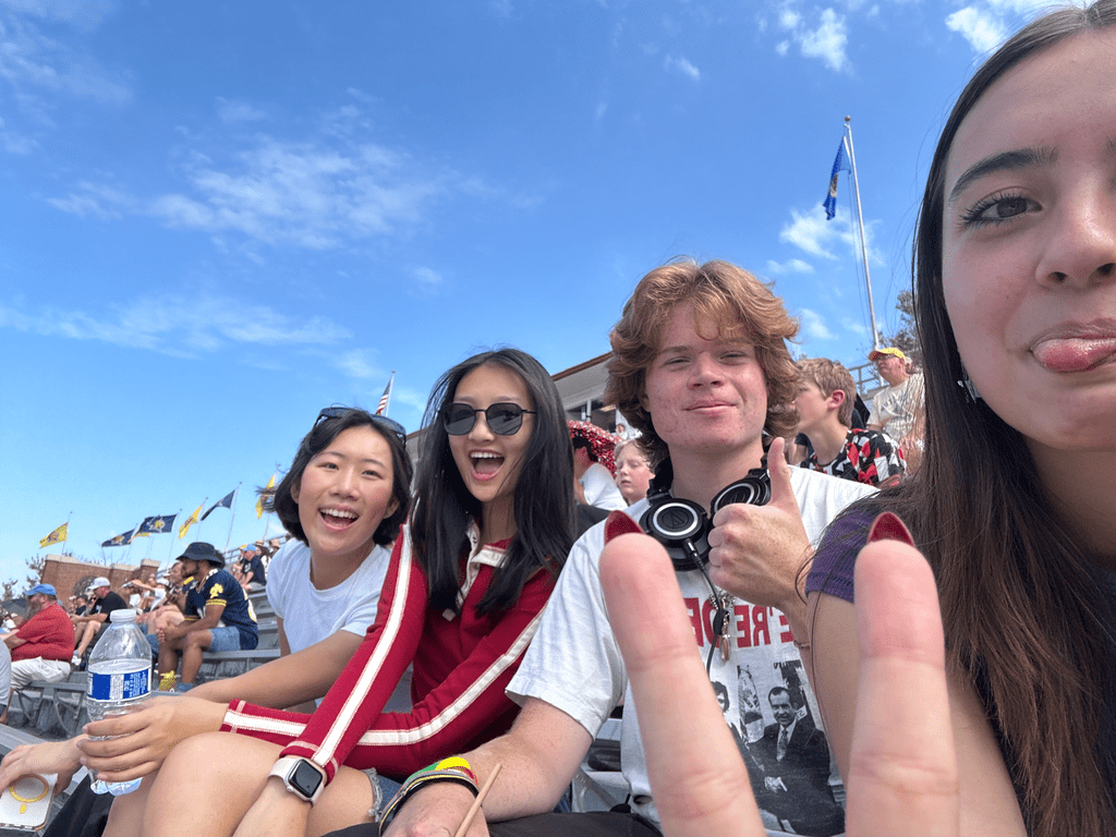 four friends at a football game